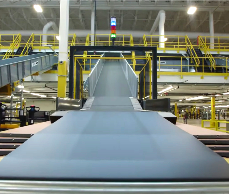 The interior of the Albert Jackson Processing Centre is vast and full of large scale mail sorting machinery.