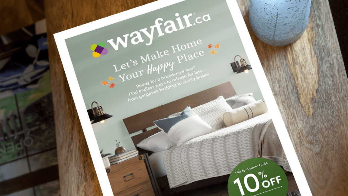 A Wayfair furniture and home goods mini-catalogue on a table top
